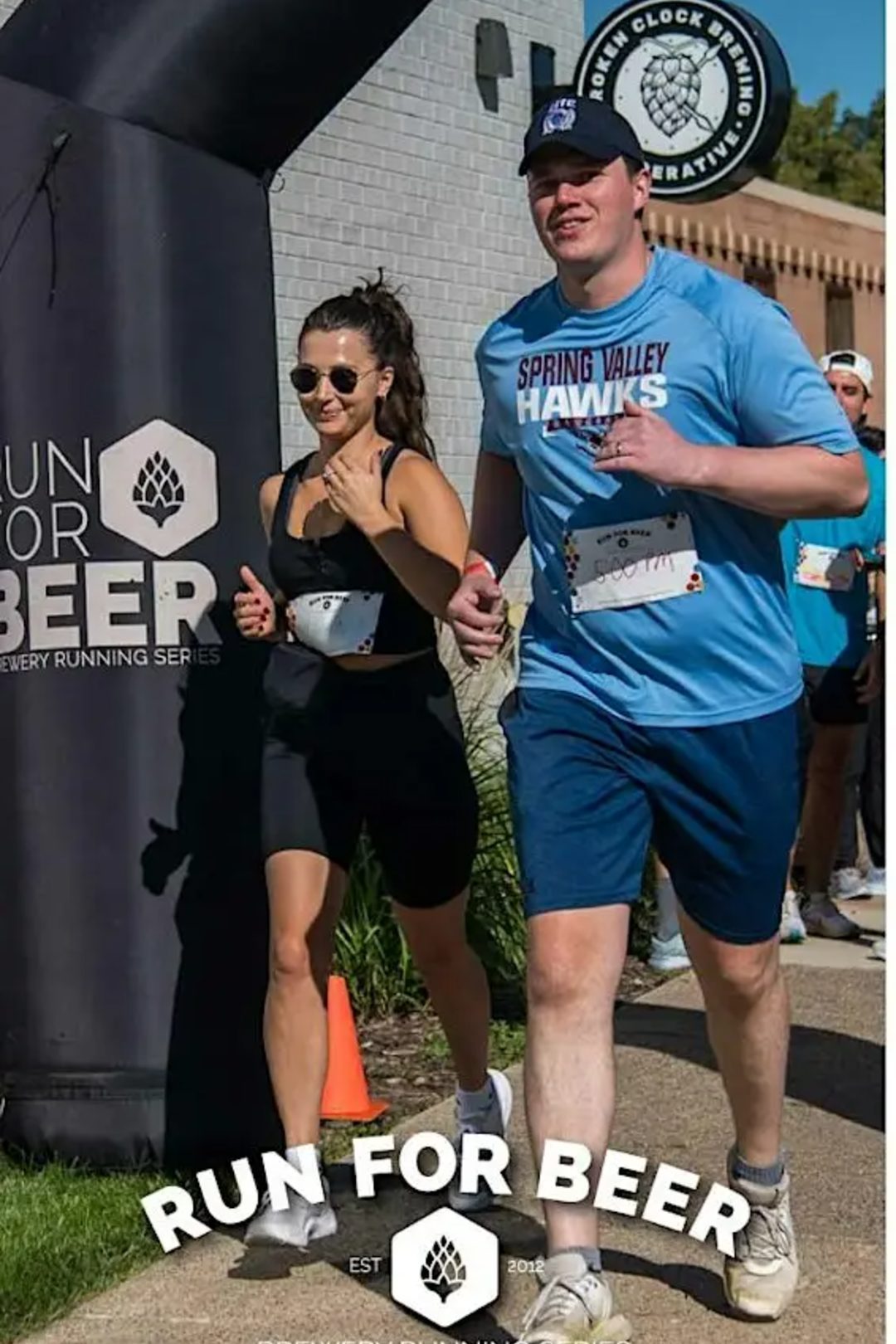 Two people running outdoors with large text "Run for Beer"